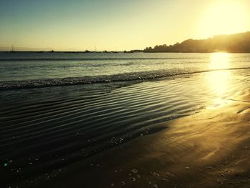 Scenic view of sea against clear sky during sunset