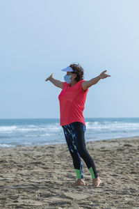 Rear view of person standing on beach