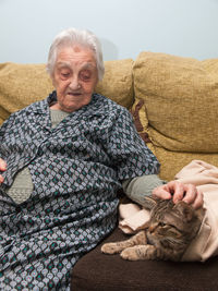 Portrait of a woman relaxing on sofa