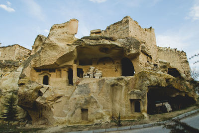 Low angle view of old ruin building against sky