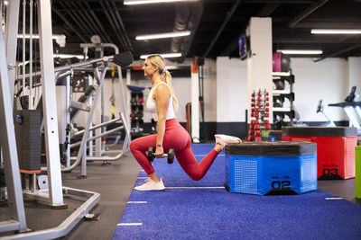 A woman exercising in the gym.