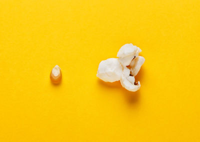 High angle view of ice cream over yellow background