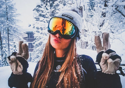 Portrait of young woman in snow