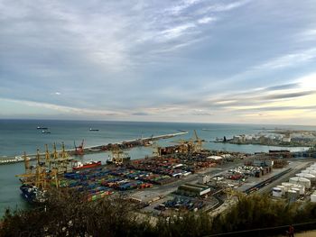 High angle view of harbor by sea against sky