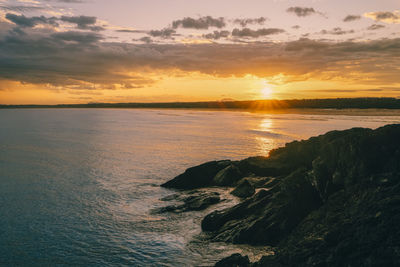 Scenic view of sea against sky during sunset