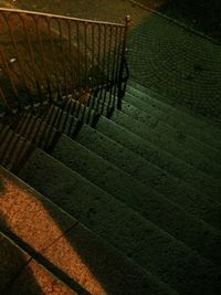 High angle view of shadow on footpath