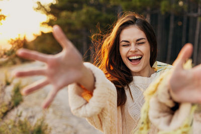 Close-up of cheerful woman outdoors