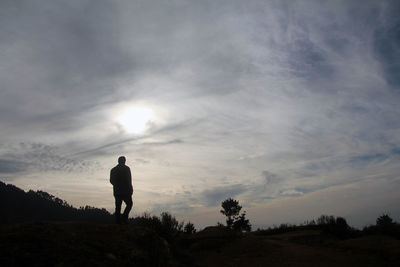 Silhouette of person standing on landscape