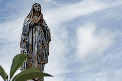 Low angle view of statue against sky
