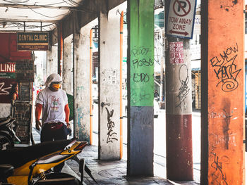 Rear view of people on street in city