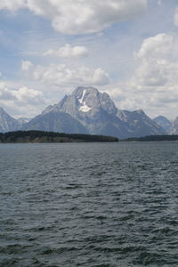 Scenic view of lake and mountains against sky