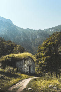 Abandoned built structure by mountain