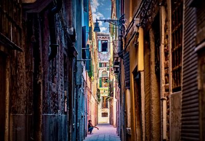 Narrow alley amidst buildings in city