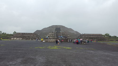 People walking in front of temple