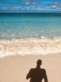 Shadow of people on beach