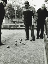 Men standing on zebra crossing