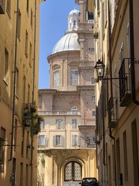 Low angle view of buildings against sky in city