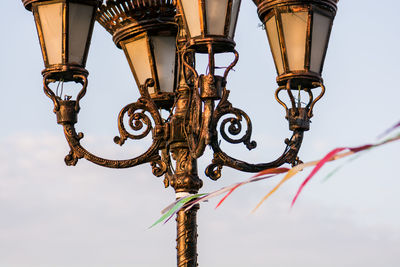 Low angle view of lantern against sky