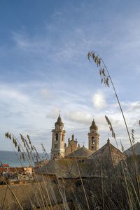 View of the sea town with the church of san matteo, laigueglia, savona, liguria, italy