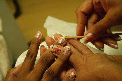 Close-up of people holding hands