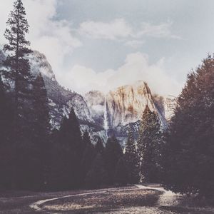 Scenic view of mountain against cloudy sky