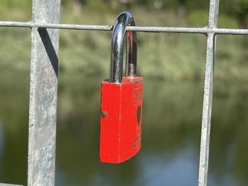 Close-up of padlocks on railing