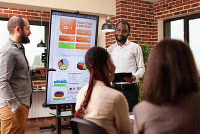 Business colleagues having discussion at office