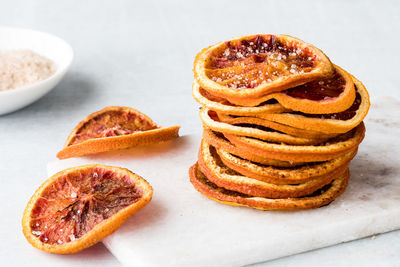 A stack of homemade dehydrated spiced blood orange slices.