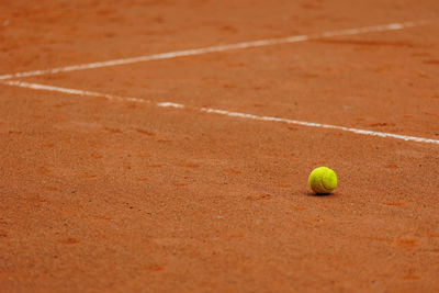 Close-up of tennis ball on playing field