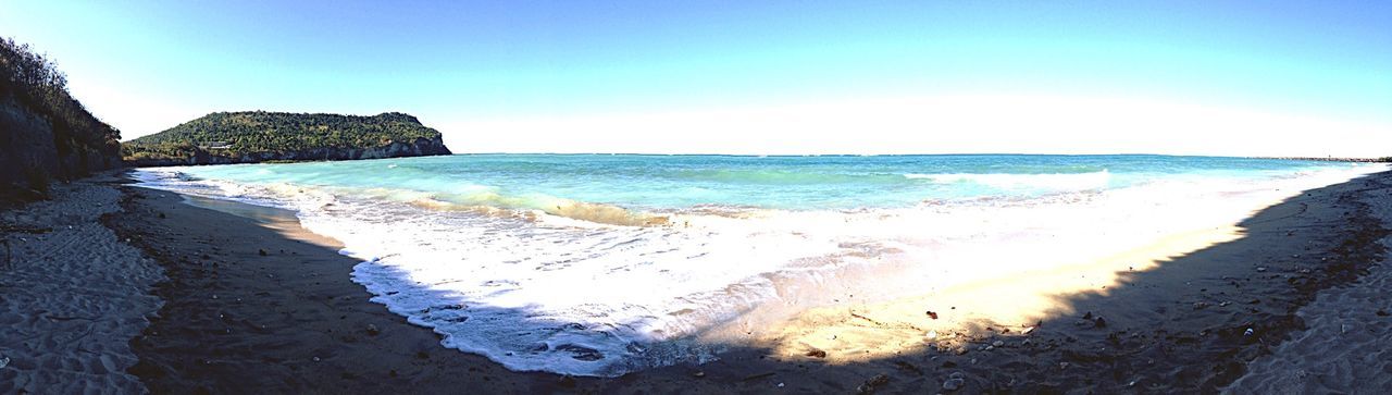 sea, beach, water, horizon over water, shore, sand, tranquil scene, scenics, tranquility, beauty in nature, nature, coastline, sky, clear sky, wave, idyllic, surf, rock - object, blue, incidental people