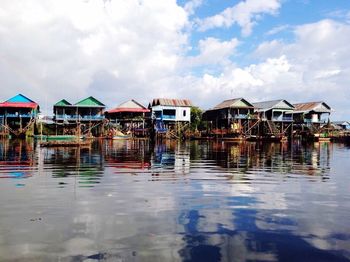 View of multi colored houses in water