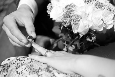 Close-up of hand holding flower