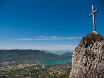 Scenic view of mountains against blue sky