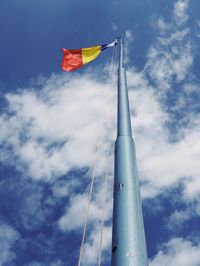 Low angle view of flag against sky