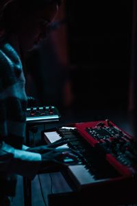 Man using smart phone at music concert