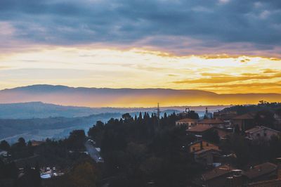 High angle view of buildings against sky at sunset