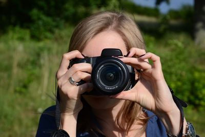 Woman photographing through camera