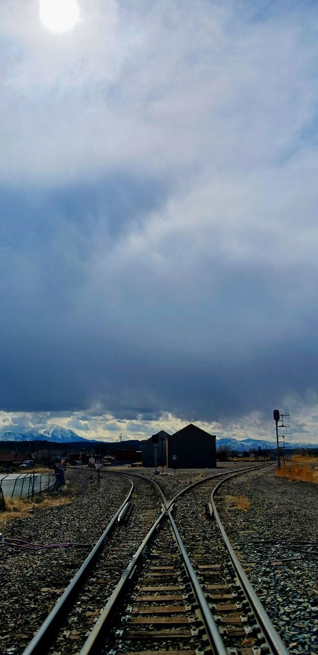 railroad track, track, rail transportation, sky, horizon, cloud, transportation, nature, sunlight, mode of transportation, morning, transport, public transportation, railway, vehicle, travel, day, no people, outdoors, the way forward, train, vanishing point, environment