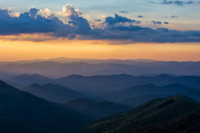 Scenic view of mountains against sky during sunset