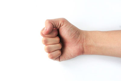 Close-up of human hand against white background