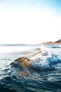 Scenic view of sea wave against sky