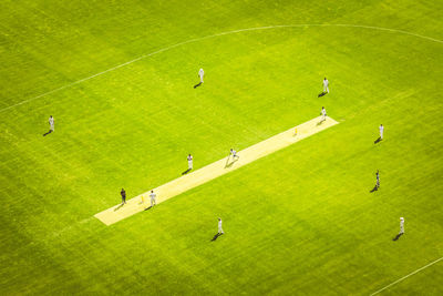 High angle view of cricketers playing on ground