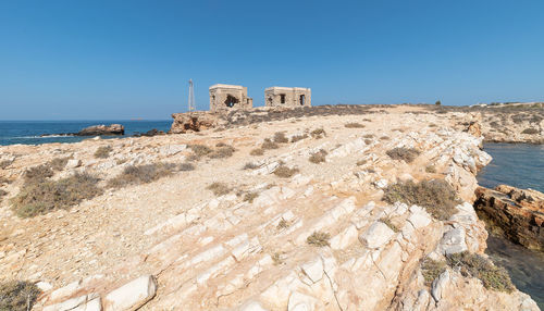 Scenic view of sea against clear blue sky