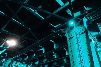 Low angle view of illuminated building against blue sky