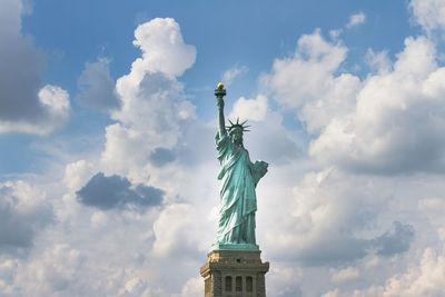 Low angle view of statue against cloudy sky