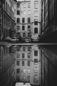 Reflection of buildings in puddle