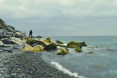 Scenic view of sea against cloudy sky