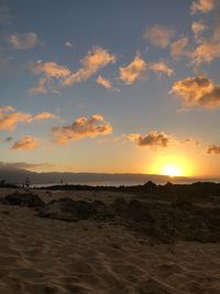 Scenic view of beach against sky during sunset