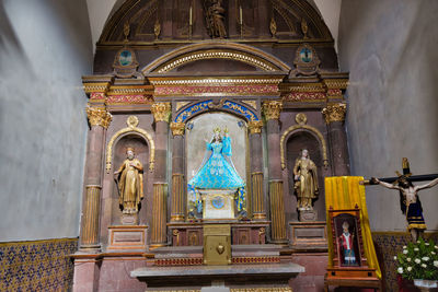 Statue in temple outside building