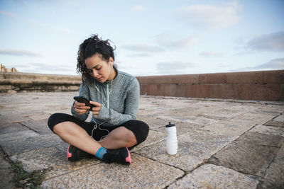 Young woman using her mobile